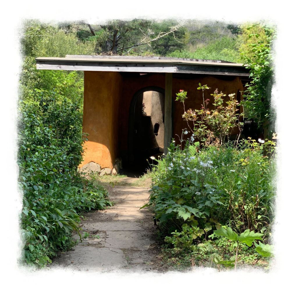 Adobe hut with pathway