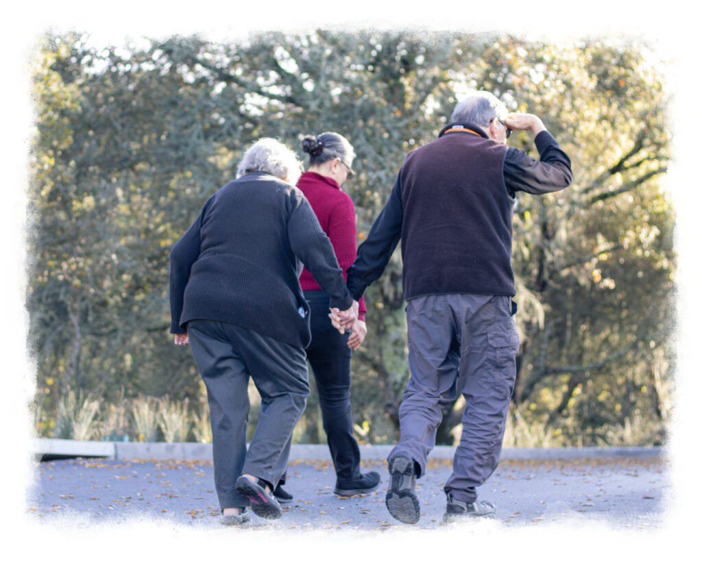 Enso Village Residents Walking with Team Member