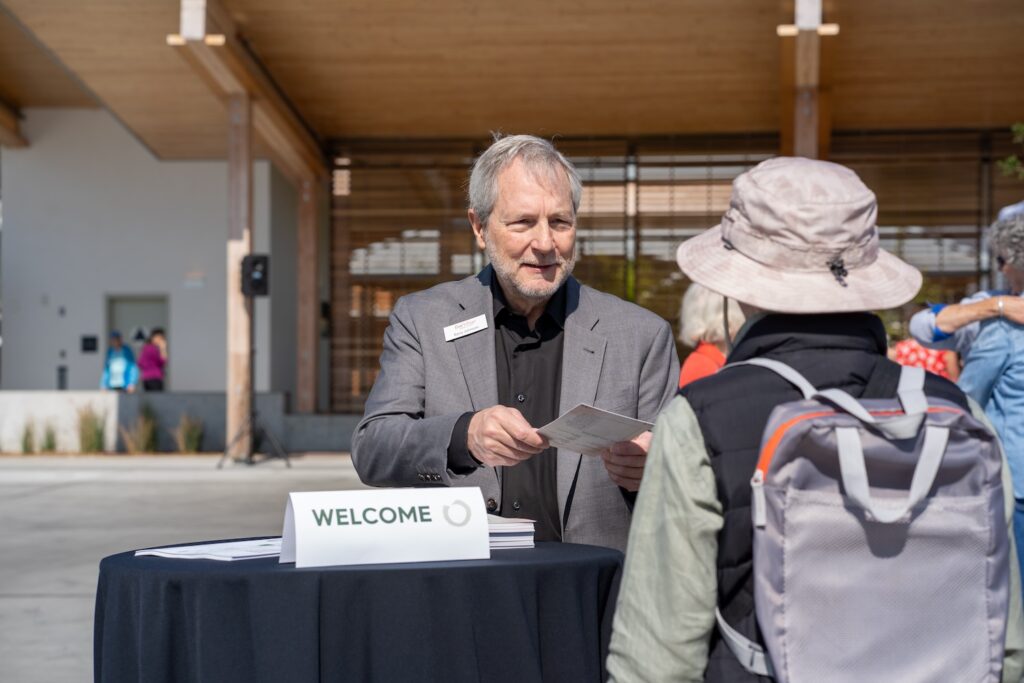 Man handing out program