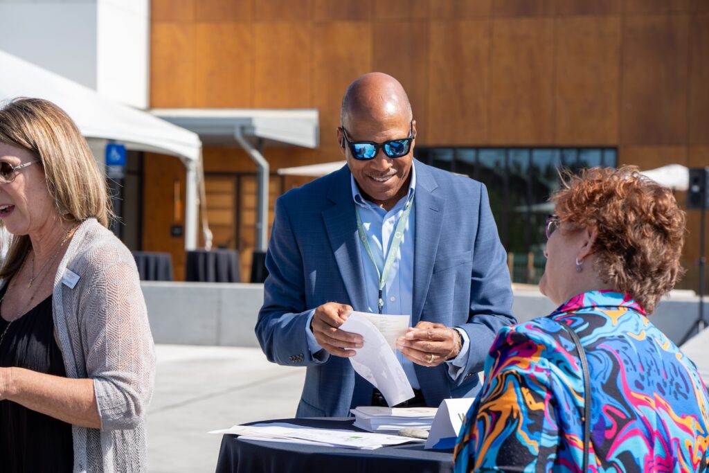 Man handing out program